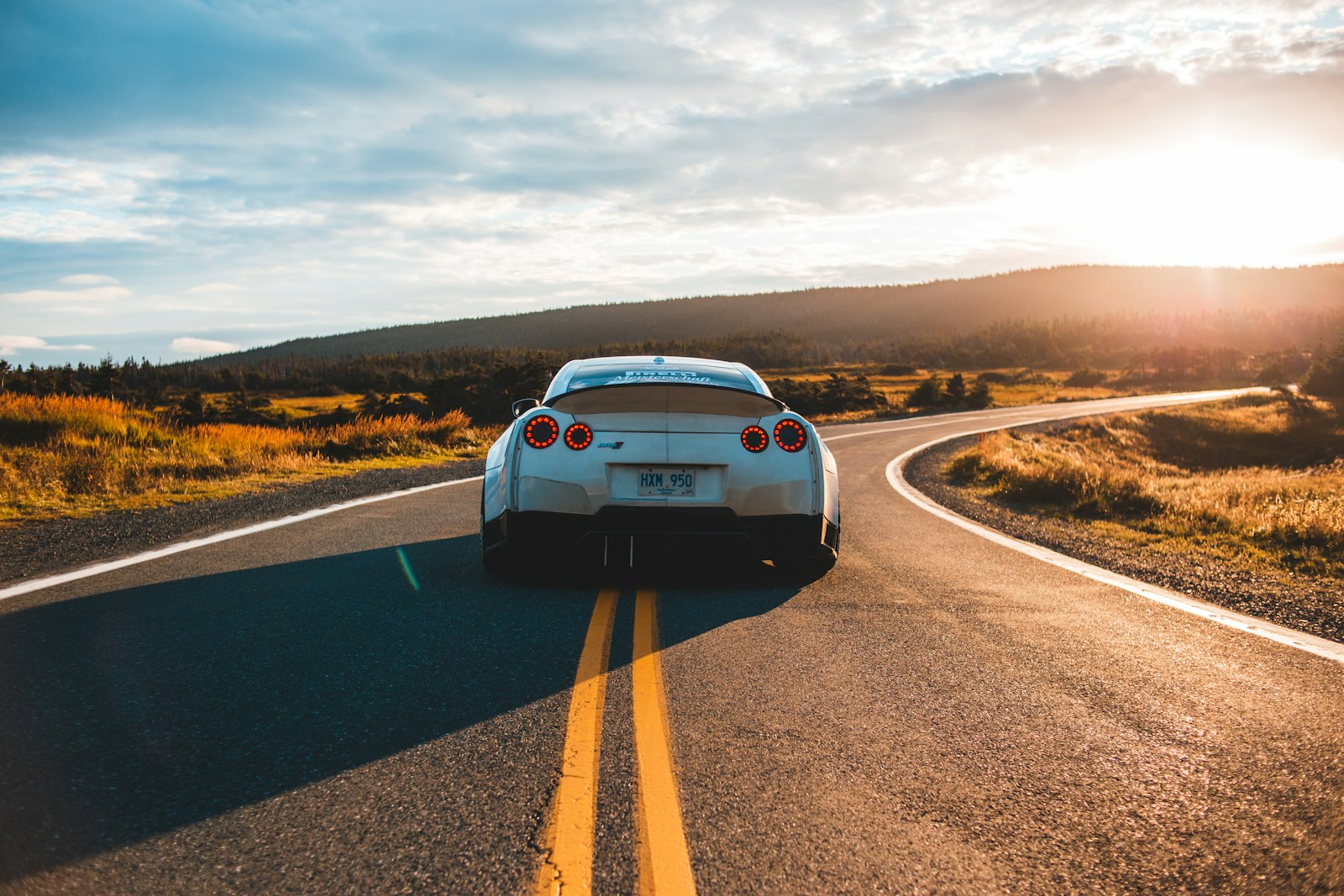 Cars on the road at dusk — the best car insurance carriers of 2026, ranked